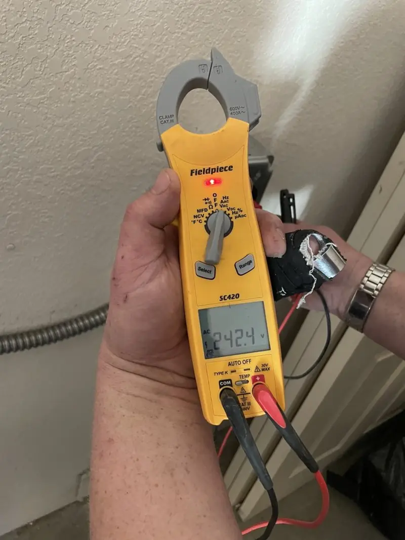 Voltage testing with clamp meter during Ceiling Fan Installation in West Bradford